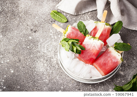 Homemade popsicles in shape of watermelon Homemade popsicles in shape of watermelon 59067941
