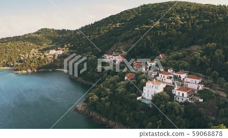 Aerial view of picturesque Kioni Bay seafront hotels and villas. Ithaca island, Greece Aerial view of picturesque Kioni Bay seafront hotels and villas. Ithaca island, Greece 59068878