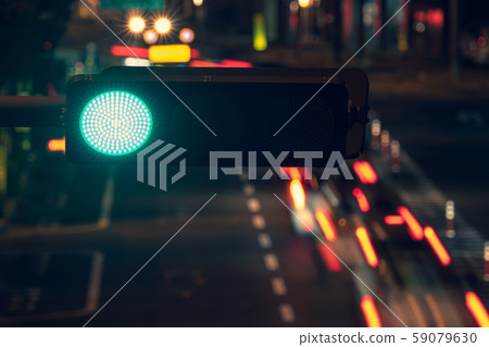 Traffic lights and traffic at night Traffic lights and traffic at night 59079630