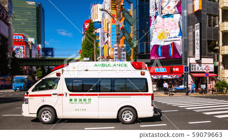 Tokyo cityscape in Japan Ambulance driving with sirens = Manseibashi intersection in Akihabara, Tokyo, where contact accidents frequently occur 59079663