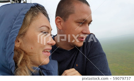 Adventure love couple on hot air balloon watermelon. Man and woman kiss hug love each other. Burner Adventure love couple on hot air balloon watermelon. Man and woman kiss hug love each other. Burner 59079737