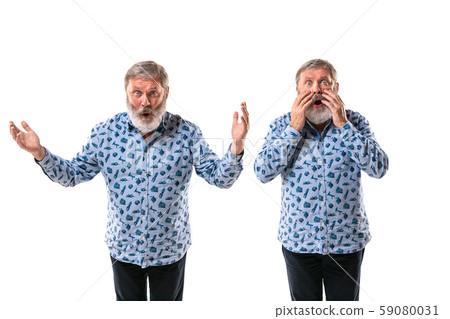 Senior man arguing with himself on white studio background. 59080031