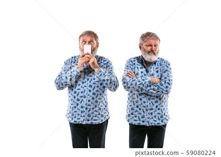Senior man arguing with himself on white studio background. Senior man arguing with himself on white studio background. 59080224