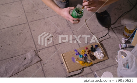 Artist designer draws an eagle on the wall. Craftsman decorator paints picture with acrylic oil Artist designer draws an eagle on the wall. Craftsman decorator paints picture with acrylic oil 59080625