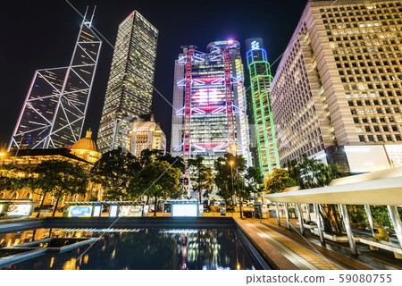 Central, Hong Kong -July 17, 2019: low angle view of modern office block buildings in Hong Kong. Central, Hong Kong -July 17, 2019: low angle view of modern office block buildings in Hong Kong. 59080755