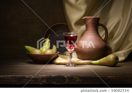 Still life with handmade clay jug, pears and a 59082554