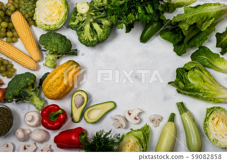 Set of different fresh raw vegetables on a light background. Top view with place for text. Set of different fresh raw vegetables on a light background. Top view with place for text. 59082858