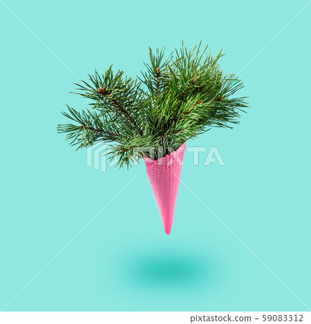 Painted pink ice cream cone with fluffy fir 59083312