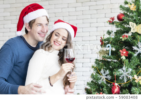Young Caucasian couple happy celebrate with wine Young Caucasian couple happy celebrate with wine 59083408