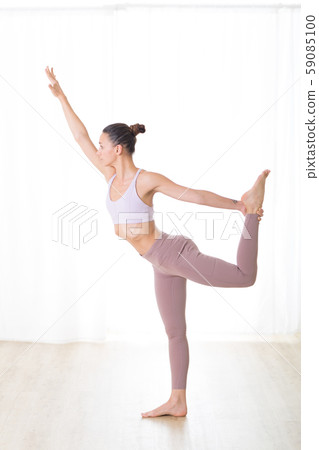 Portrait of gorgeous active sporty young woman practicing yoga in studio. Beautiful girl practice Portrait of gorgeous active sporty young woman practicing yoga in studio. Beautiful girl practice 59085100