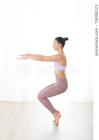 Portrait of gorgeous active sporty young woman practicing yoga in studio. Beautiful girl practice Portrait of gorgeous active sporty young woman practicing yoga in studio. Beautiful girl practice 59086323