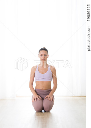 Portrait of gorgeous active sporty young woman practicing yoga in studio. Beautiful girl practice 59086325