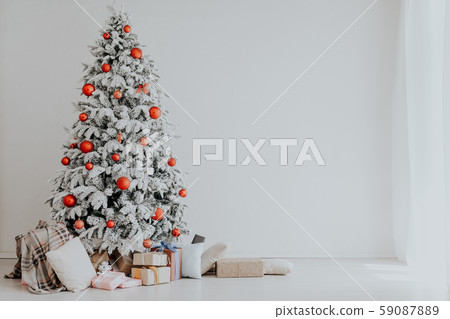White room Christmas tree with red toys new year winter gifts decor White room Christmas tree with red toys new year winter gifts decor 59087889