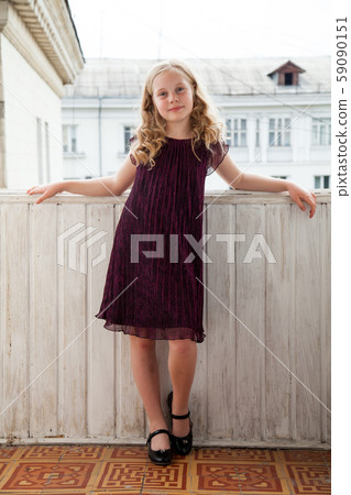 Portrait of a beautiful fashionable girl in a dark dress 59090151
