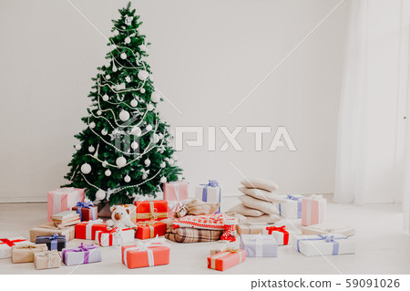 Green Christmas tree with gifts of toys for the new year holiday decor winter Green Christmas tree with gifts of toys for the new year holiday decor winter 59091026