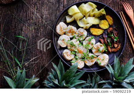 Top view vegan Vietnamese eating indoor restaurant, vegetarian rice rolls cut in slice with vegetable Top view vegan Vietnamese eating indoor restaurant, vegetarian rice rolls cut in slice with vegetable 59092219