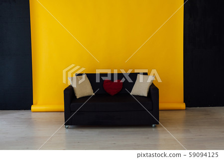 black office sofa in the interior of the room with a yellow background black office sofa in the interior of the room with a yellow background 59094125