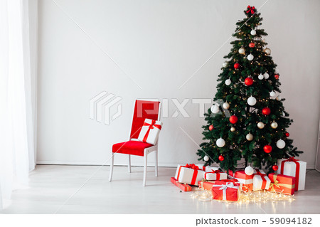 Christmas tree with gifts in the interior of the house decor for the new year 59094182