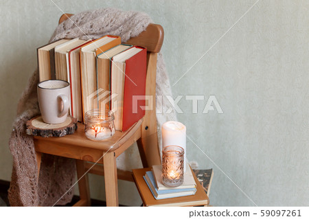 Mug with coffee and home decor on wooden chair. Mug with coffee and home decor on wooden chair. 59097261