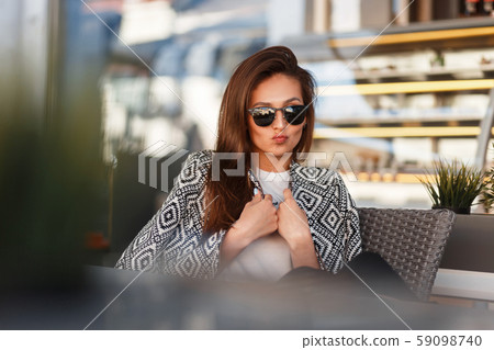 Funny beautiful young woman with trendy sunglasses 59098740