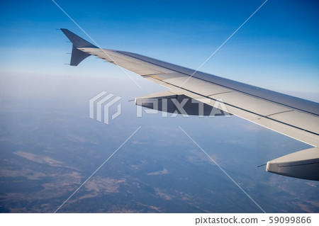 Looking through aircraft window Looking through aircraft window 59099866