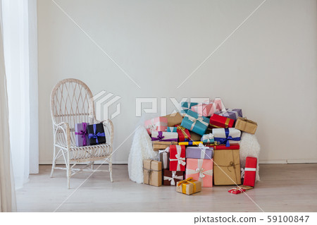 lots of gifts in the inder of the empty white room 59100847