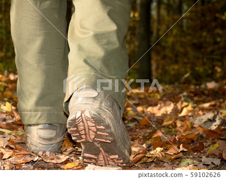 Woman in high leather shoes or boots walking on Woman in high leather shoes or boots walking on 59102626