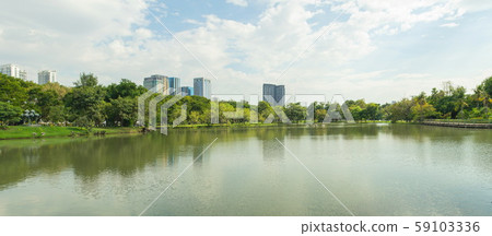 Panorama view of City public park with lake and green trees in background. 59103336