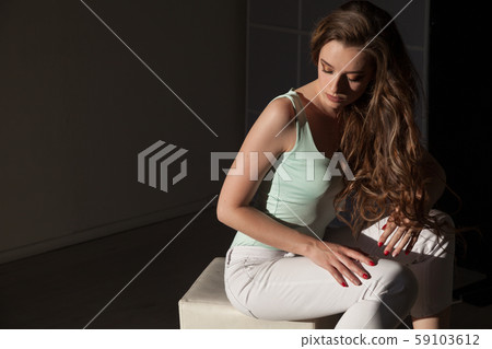 Portrait of a fashionable beautiful girl with long hair Portrait of a fashionable beautiful girl with long hair 59103612
