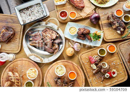 Barbecue restaurant menu. Many different food on the table. Dinner party or Banquet. Top view Barbecue restaurant menu. Many different food on the table. Dinner party or Banquet. Top view 59104709