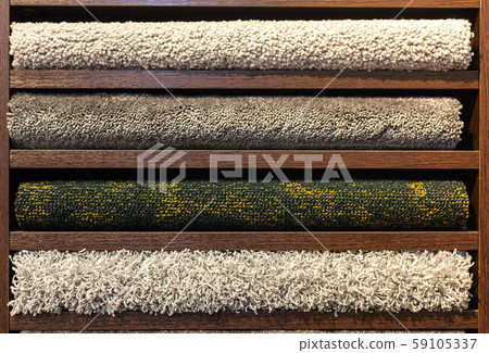 samples of multi-colored carpets on the shelves samples of multi-colored carpets on the shelves 59105337