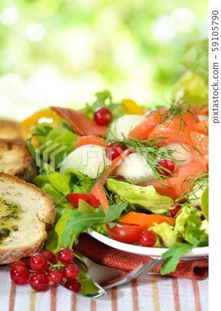 Summer salad with honeydew melon balls and smoked wild salmon Summer salad with honeydew melon balls and smoked wild salmon 59105790