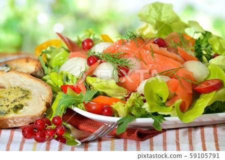 Summer salad with honeydew melon balls and smoked wild salmon Summer salad with honeydew melon balls and smoked wild salmon 59105791