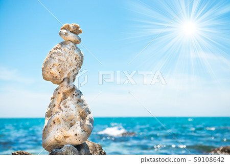 Zen stones balance at sea background Zen stones balance at sea background 59108642