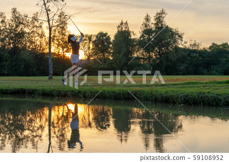 Healthy Sport. Asian Sporty woman golfer player Healthy Sport. Asian Sporty woman golfer player 59108952
