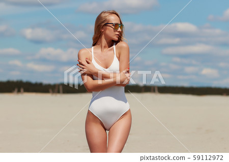 Confident sexy woman in seductive posture pulling Confident sexy woman in seductive posture pulling 59112972
