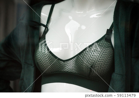 Closeup of green bra on mannequin in fashion store Closeup of green bra on mannequin in fashion store 59113479