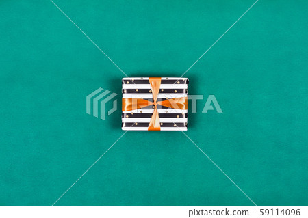 Present gift box on green background. Present gift box on green background. 59114096