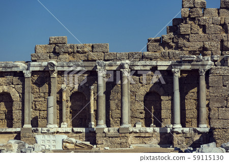 Ruins of the ancient city of Side and the Amphitheatre photo with the bird flight. Ruins of the ancient city of Side and the Amphitheatre photo with the bird flight. 59115130