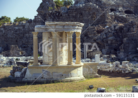 Ruins of the ancient city of Side and the Amphitheatre photo with the bird flight. Ruins of the ancient city of Side and the Amphitheatre photo with the bird flight. 59115131
