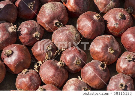 Background iz fruit ripe pomegranates shot closeup  59115153