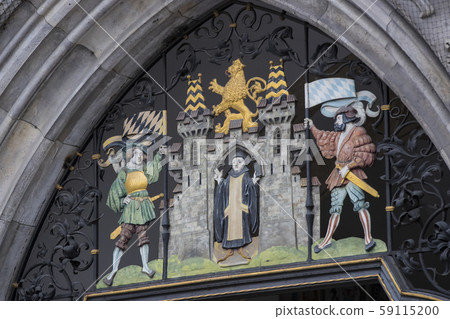 Munich. Elements of architecture and statues of the new city hall on Marienplatz in the center of Munich. Elements of architecture and statues of the new city hall on Marienplatz in the center of 59115200