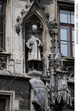 Munich. Elements of architecture and statues of the new city hall on Marienplatz in the center of Munich. Elements of architecture and statues of the new city hall on Marienplatz in the center of 59115201