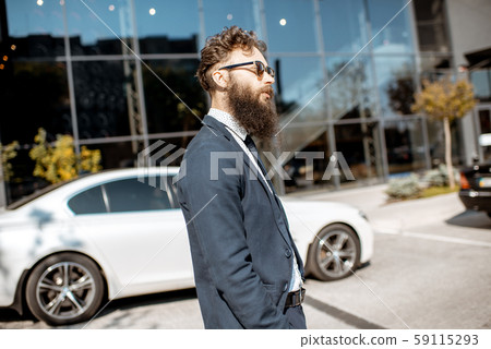 Businessman near the office outdoors Businessman near the office outdoors 59115293