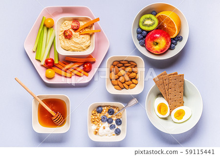 Healthy snack on a pastel background. Healthy snack on a pastel background. 59115441