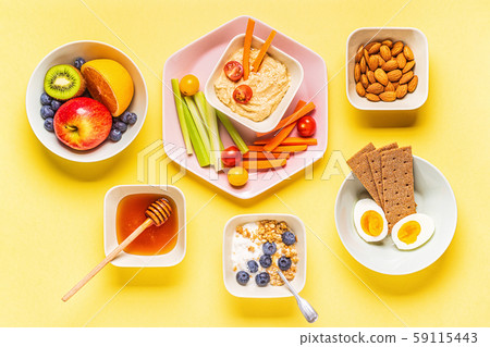 Healthy snack on a pastel background. Healthy snack on a pastel background. 59115443