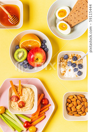 Healthy snack on a pastel background. Healthy snack on a pastel background. 59115444