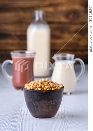 Chocolate milk and soy milk in glass on white 59116264