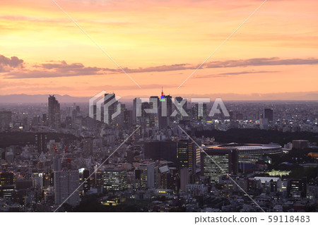 Tokyo cityscape in Japan Views of the Shinjuku sub-center that shines in the sunset after a typhoon and the new National Stadium scheduled to be completed in December 59118483