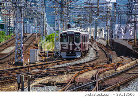 Hankyu Railway leaving Osaka Juso Station 59118506